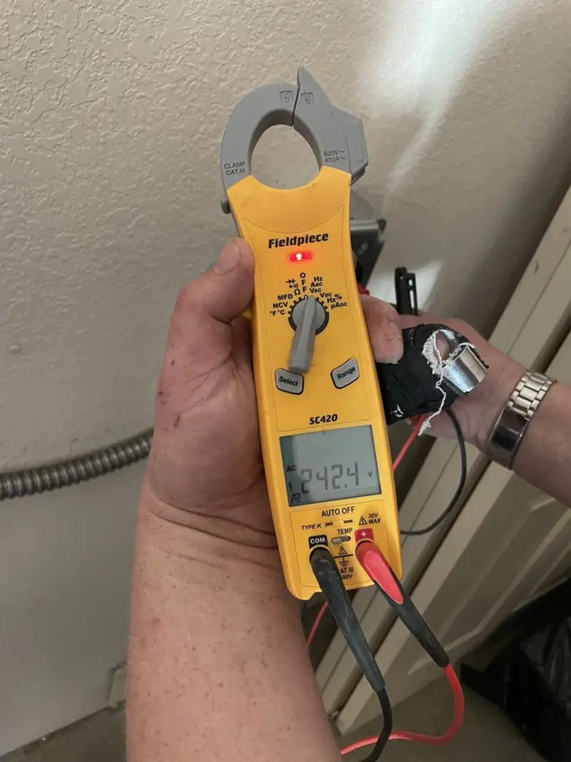Voltage testing with clamp meter during Electrical Installation Services in Fellsmere